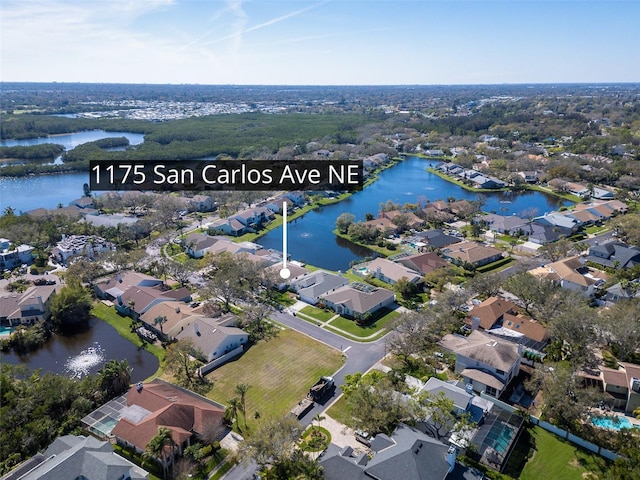 bird's eye view with a residential view and a water view