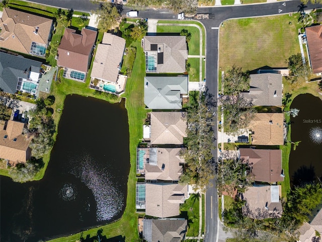 aerial view featuring a water view and a residential view