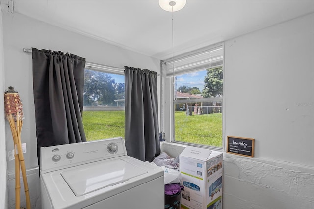 washroom with laundry area and washer / clothes dryer