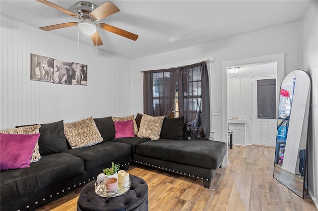 living room with ceiling fan and wood finished floors