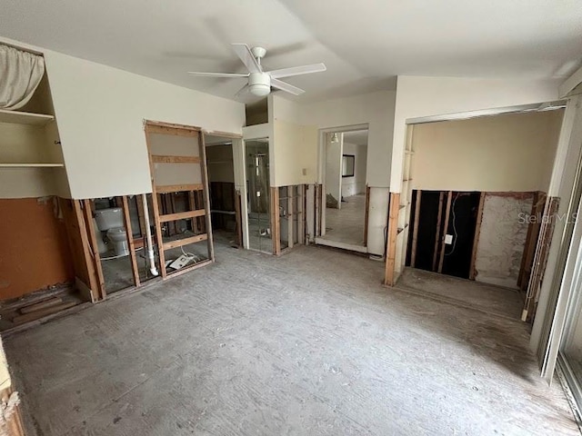 unfurnished living room featuring lofted ceiling and ceiling fan