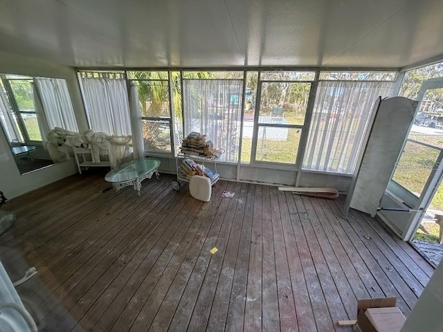 unfurnished sunroom with plenty of natural light