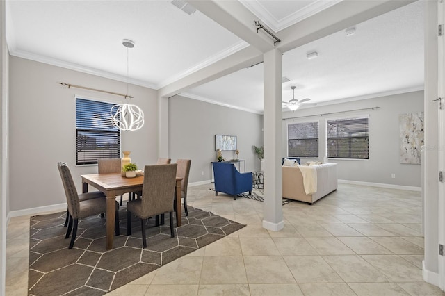 dining room with ceiling fan with notable chandelier, crown molding, baseboards, and light tile patterned floors