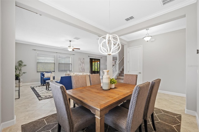 dining room featuring light tile patterned floors, baseboards, visible vents, stairway, and crown molding