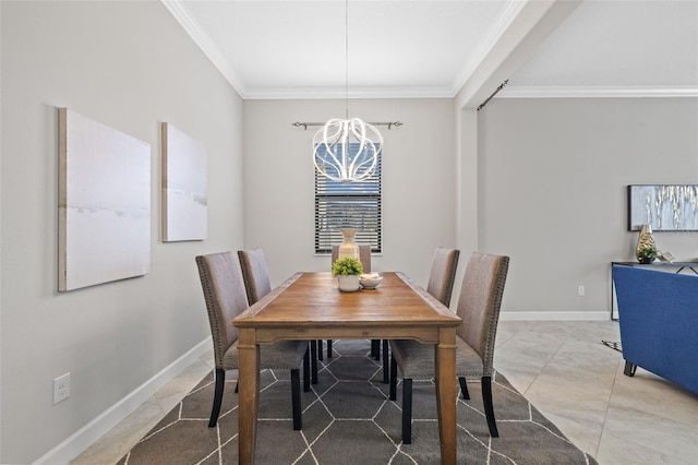 dining space with ornamental molding and baseboards