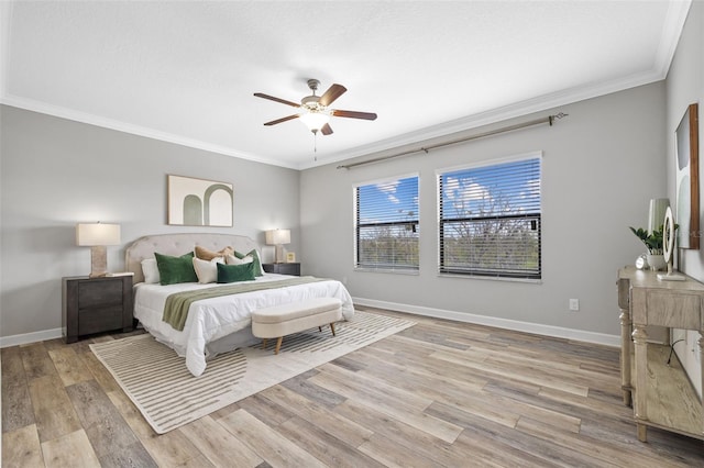 bedroom with crown molding, baseboards, a ceiling fan, and light wood-style floors