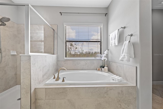 bathroom with a garden tub and a shower stall