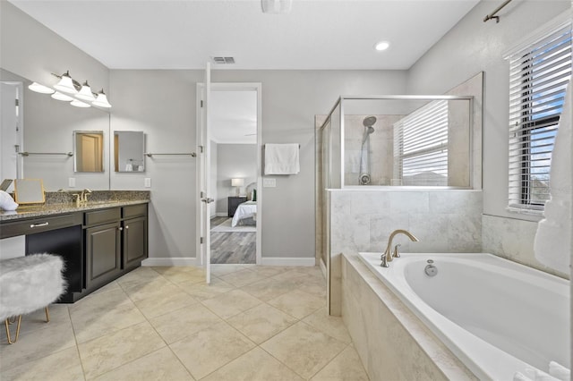 ensuite bathroom featuring a garden tub, visible vents, a stall shower, ensuite bath, and tile patterned floors