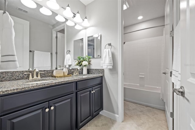 bathroom with tile patterned floors, visible vents, a sink, and shower / bathtub combination