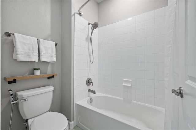 full bathroom with shower / bath combo and toilet