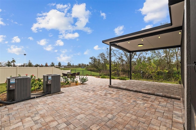 view of patio featuring central AC and a fenced backyard