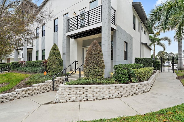 1110 25th St N, Saint Petersburg, FL 33713 - view of property exterior with a gate, fence, and stucco siding