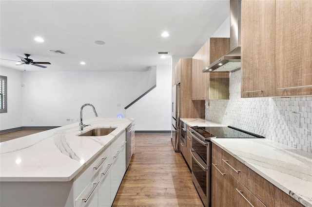 1110 25th St N, Saint Petersburg, FL 33713 - kitchen featuring wall chimney range hood, modern cabinets, white cabinetry, and stainless steel appliances
