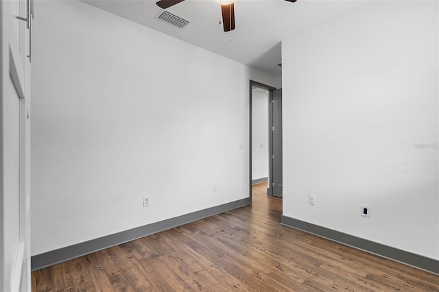1110 25th St N, Saint Petersburg, FL 33713 - spare room with visible vents, dark wood finished floors, baseboards, and ceiling fan