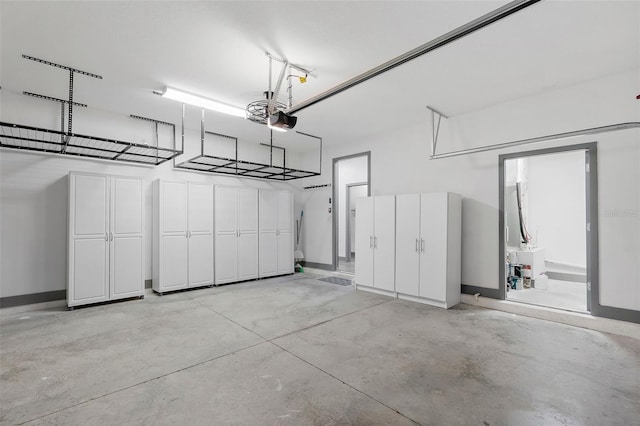 1110 25th St N, Saint Petersburg, FL 33713 - garage with baseboards and a garage door opener