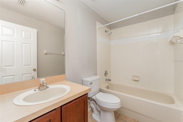 bathroom featuring tile patterned flooring, toilet, vanity, visible vents, and tub / shower combination