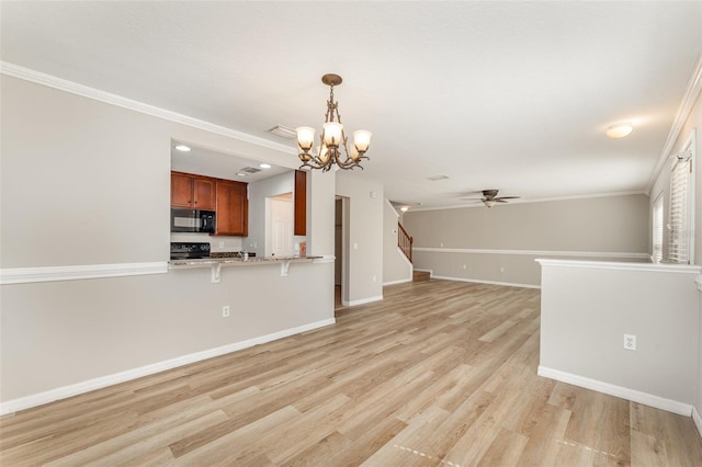 unfurnished living room with light wood finished floors, stairway, ornamental molding, baseboards, and ceiling fan with notable chandelier