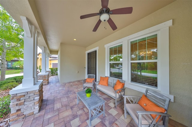 view of patio with a ceiling fan and a porch