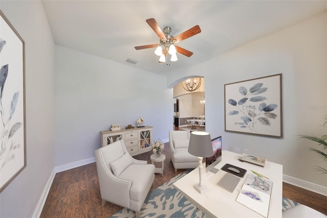 office area featuring baseboards, visible vents, arched walkways, and dark wood finished floors