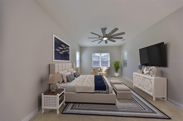 carpeted bedroom featuring visible vents, baseboards, and a ceiling fan