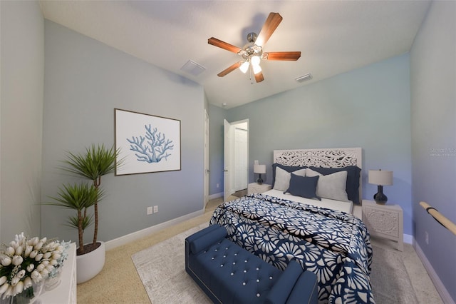 bedroom with a ceiling fan, light colored carpet, visible vents, and baseboards