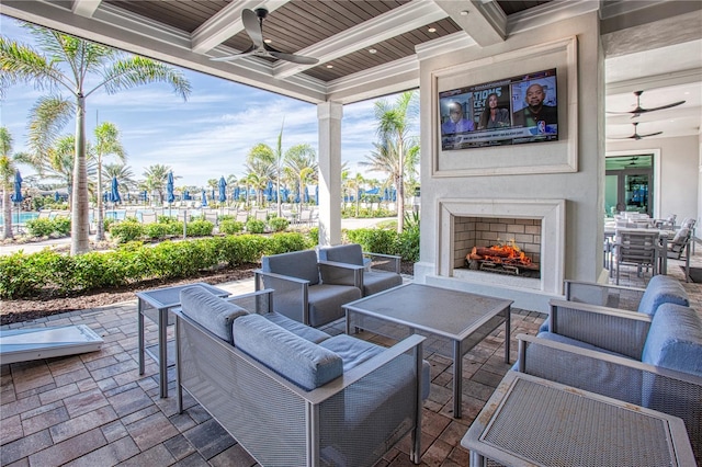 view of patio / terrace with an outdoor living space with a fireplace