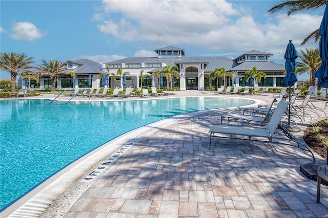 community pool with a patio area