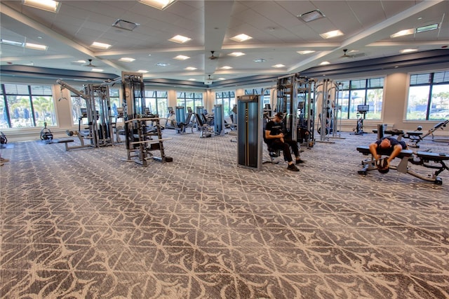 exercise room with carpet floors, visible vents, and a wealth of natural light