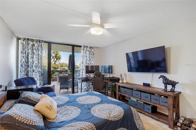 bedroom featuring ceiling fan, access to outside, and floor to ceiling windows