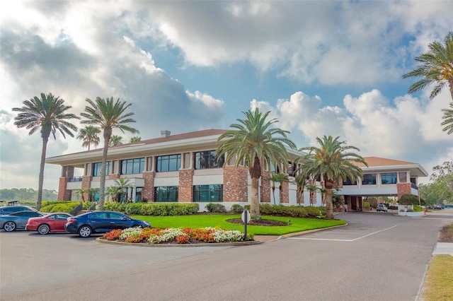 view of building exterior featuring uncovered parking