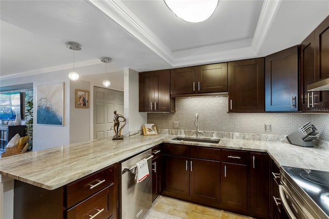 kitchen featuring appliances with stainless steel finishes, light stone counters, a peninsula, a tray ceiling, and a sink