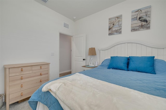 carpeted bedroom with visible vents