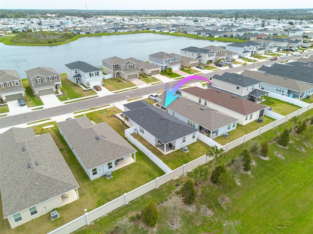 bird's eye view with a residential view and a water view