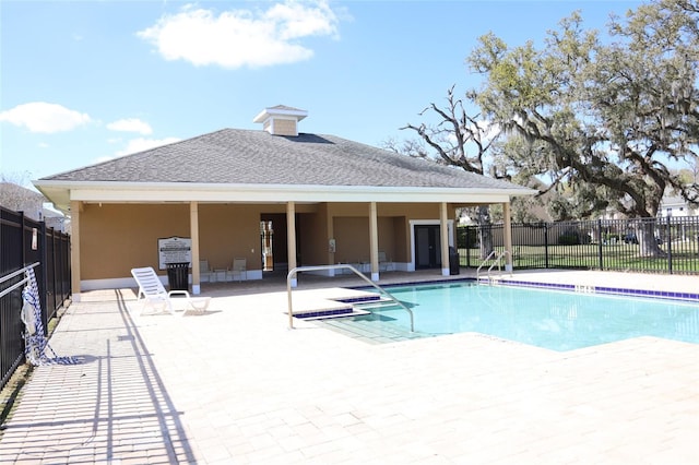 community pool featuring a patio and fence