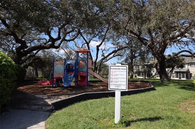 community play area with a lawn