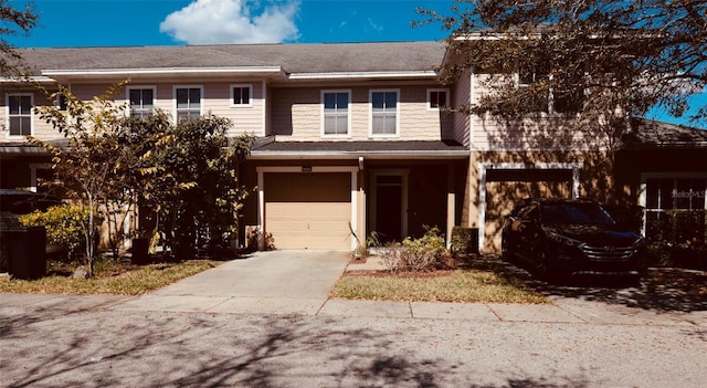 8010 Bally Money Rd, Tampa, FL 33610 - multi unit property featuring a garage and concrete driveway