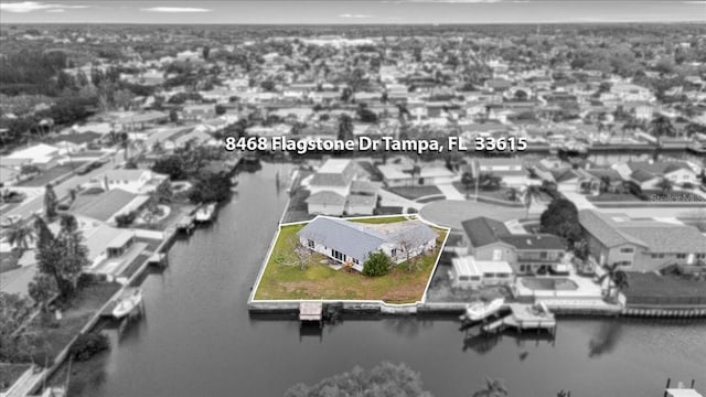 birds eye view of property with a residential view and a water view