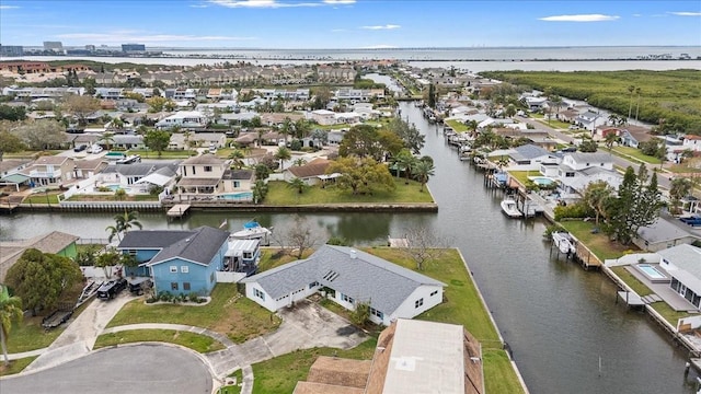 birds eye view of property with a water view and a residential view