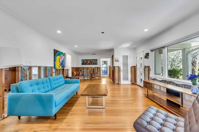 living area featuring light wood finished floors and recessed lighting