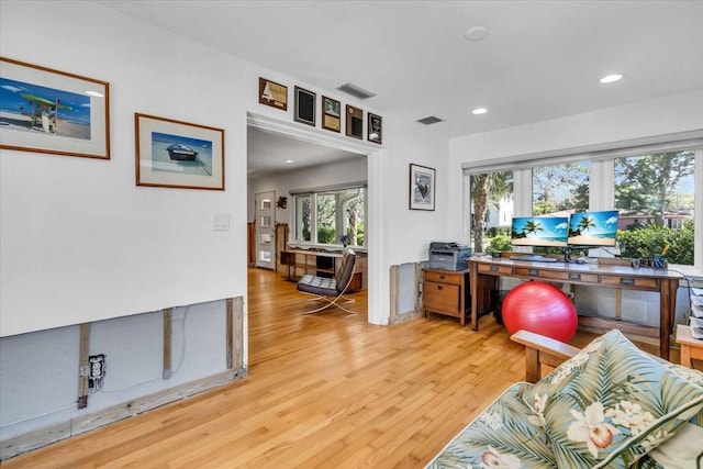 home office featuring visible vents, wood finished floors, and recessed lighting