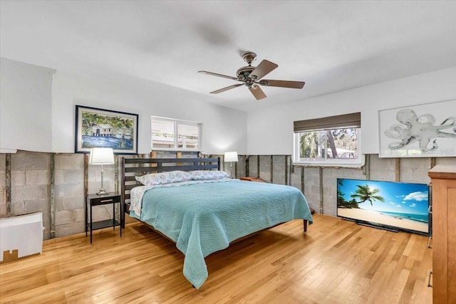 bedroom with ceiling fan and wood finished floors