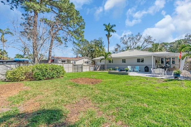 view of yard with a patio and fence