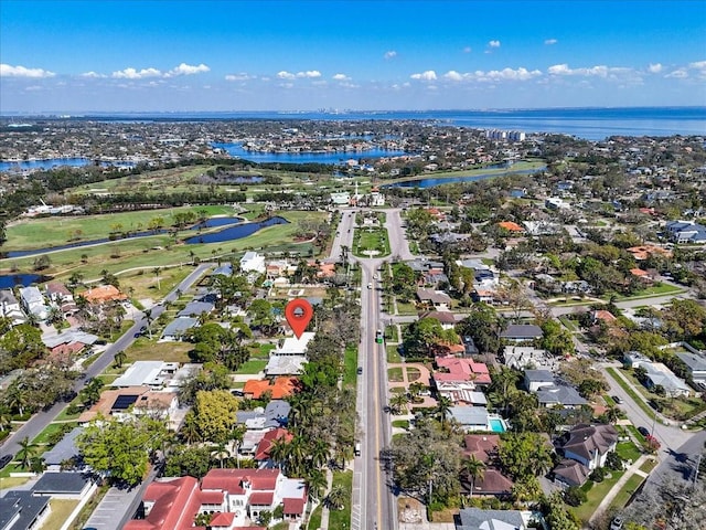 bird's eye view featuring a water view and a residential view