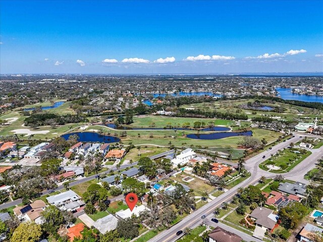 birds eye view of property featuring a residential view, view of golf course, and a water view