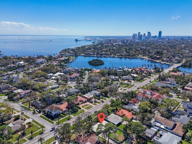 birds eye view of property featuring a water view and a residential view