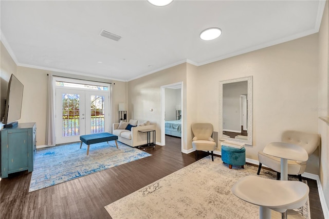 living area with dark wood-style floors, baseboards, visible vents, and french doors