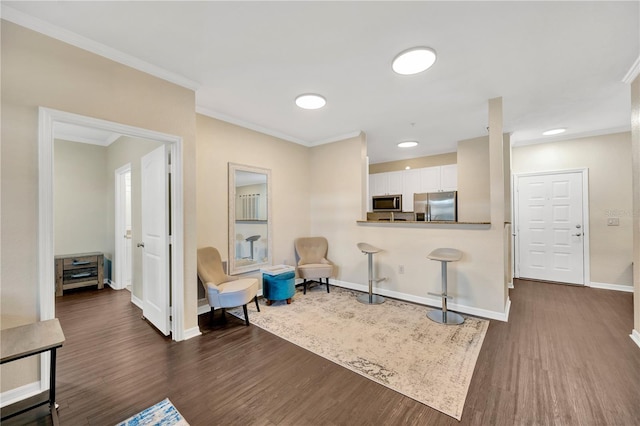 interior space with crown molding, dark wood finished floors, and baseboards