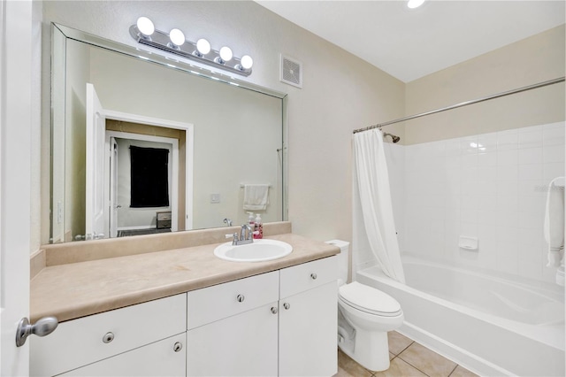 full bathroom with visible vents, shower / bathtub combination with curtain, toilet, vanity, and tile patterned floors