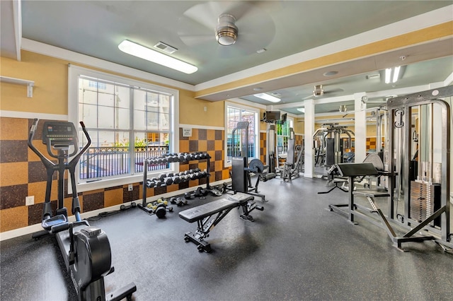 gym featuring a ceiling fan, visible vents, and baseboards