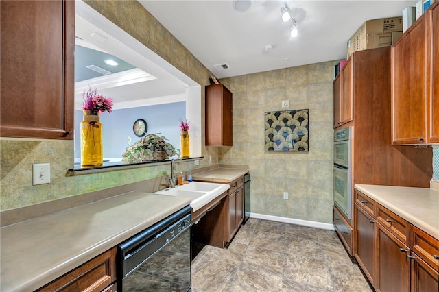 kitchen featuring black dishwasher, light countertops, brown cabinetry, and visible vents